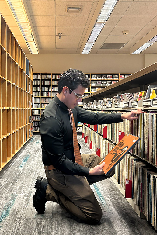 Esteban Zúñiga looking at records