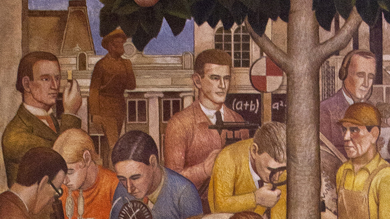 Detail of the "Development of Science" mural with Pioneer Father statue in background