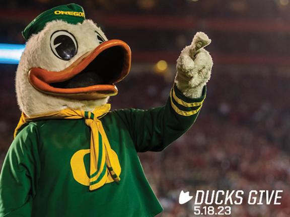 UO Duck with #DucksGive logo and date 5.18.23