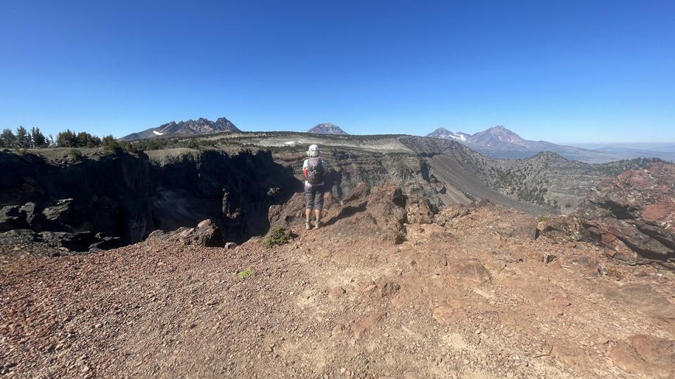 Sheryl Steinke enjoys a stunning view of Oregon mountains in the Cascade range