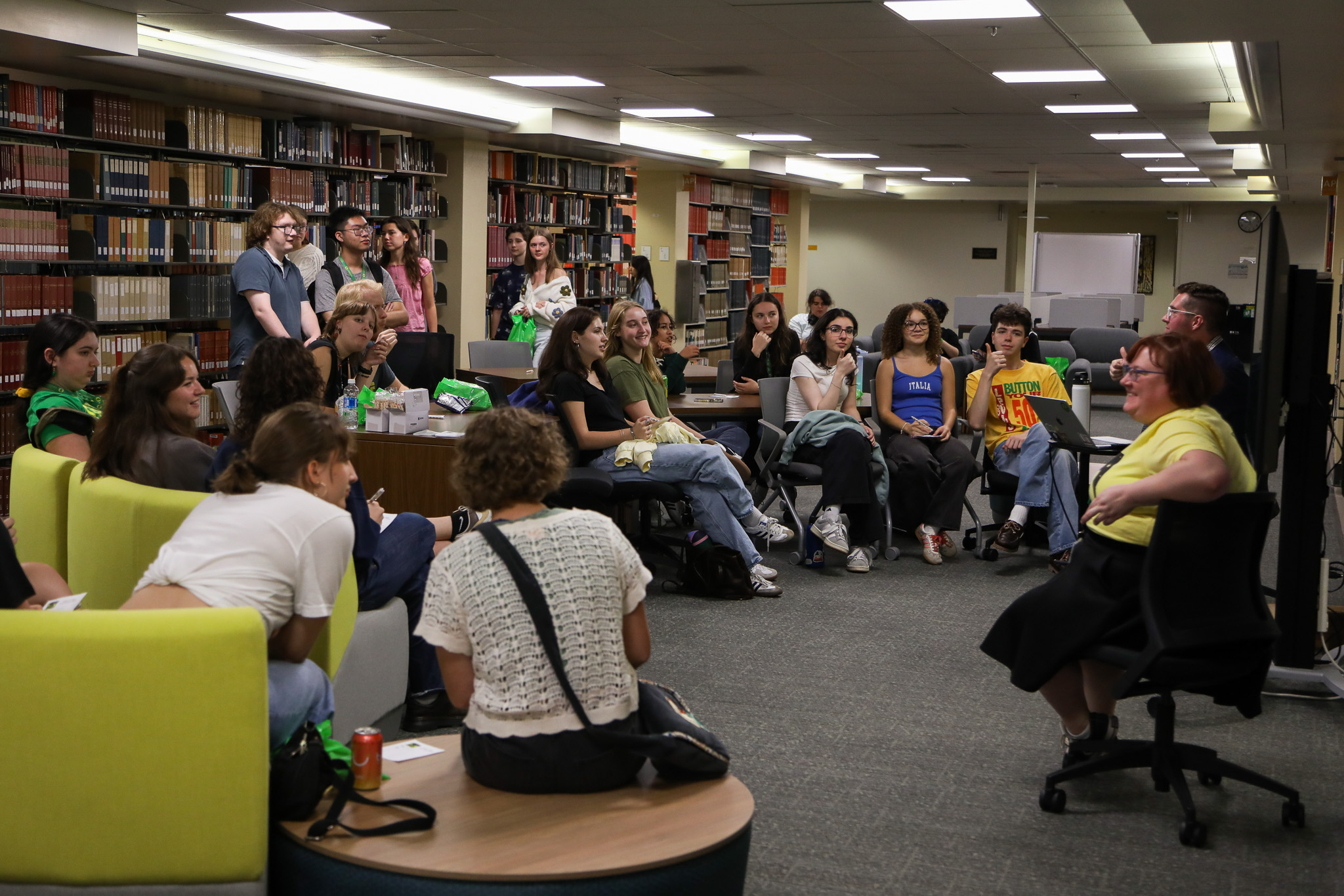 Diverse group of students playing trivia in Knight Library.