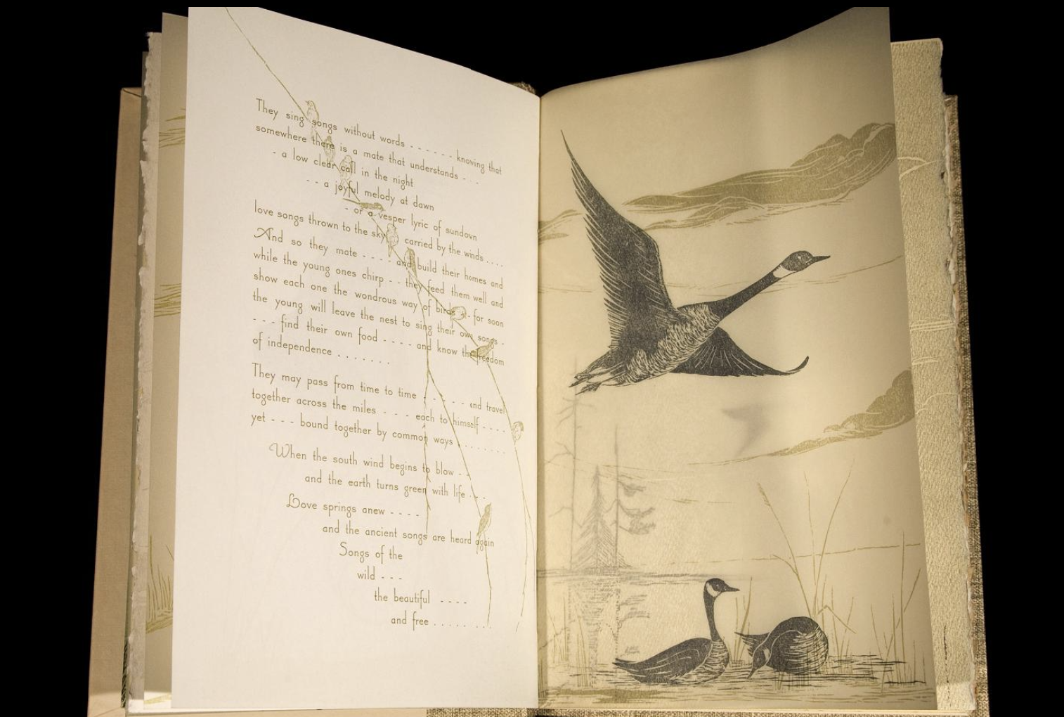 Open artists book reveals poetry text and woodblock print of geese on facing pages.