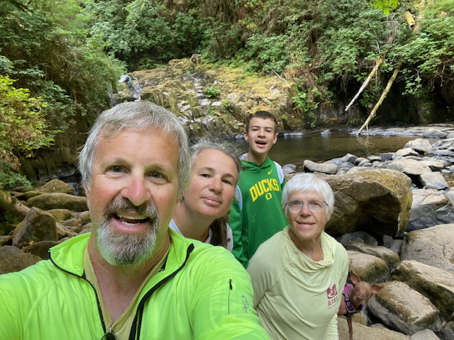 Sheryl and family by a creek