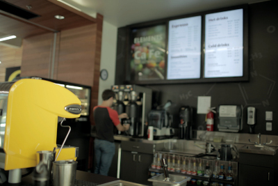 Student working in a cafe.