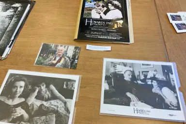 Photographs and movie-related materials on a table top.