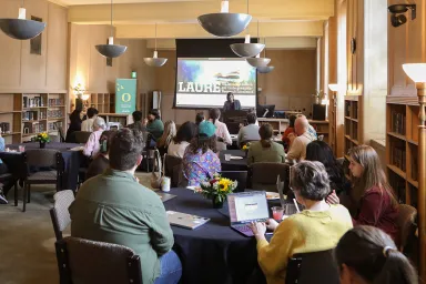 People attending presentation in Knight Library Browsing Room