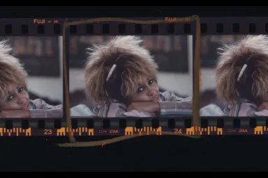 Tina Turner film-strip with head tilted resting on her arm