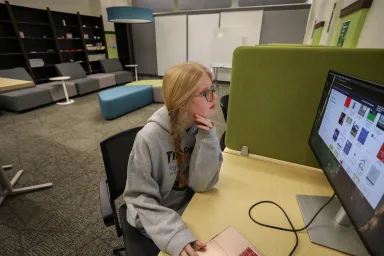 Student working at computer in GradSpace