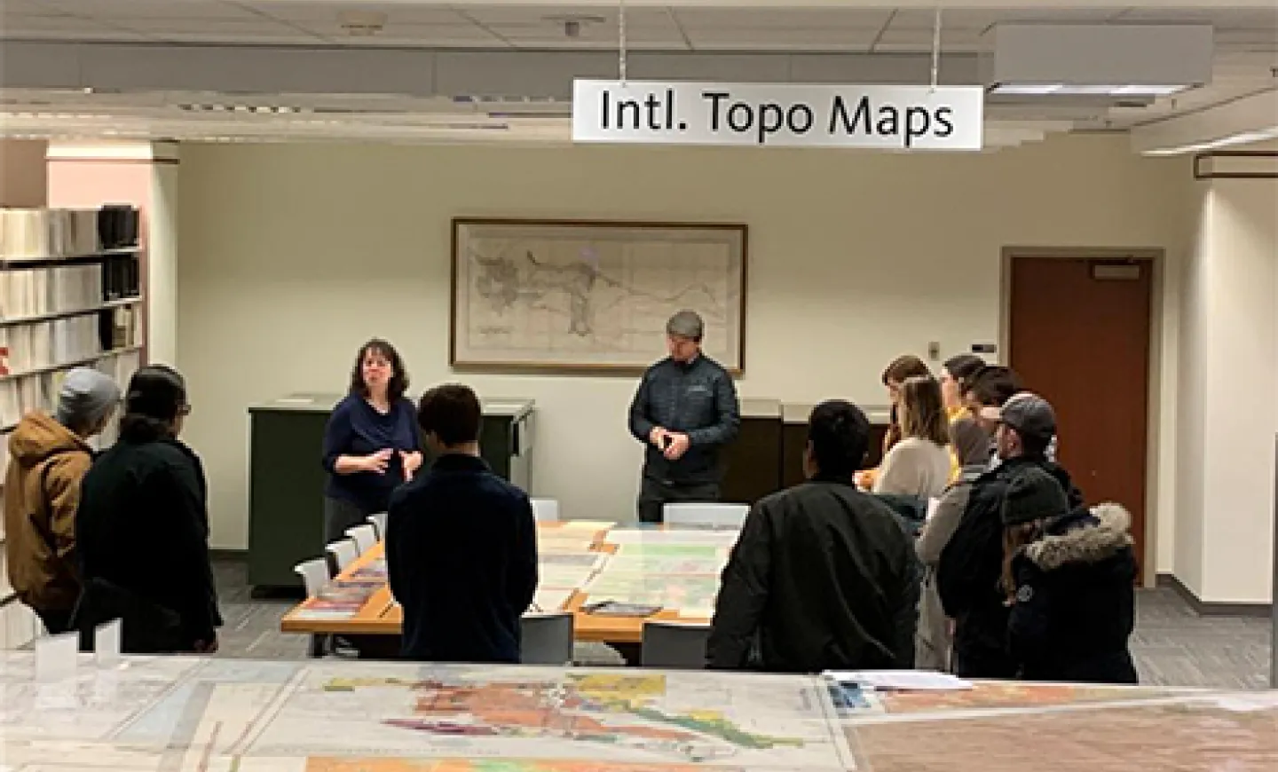 Librarian Kathy Stroud provides instruction about maps to UO students in Knight Library.