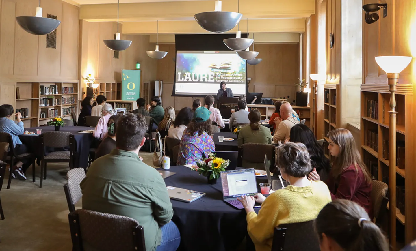 People attending presentation in Knight Library Browsing Room