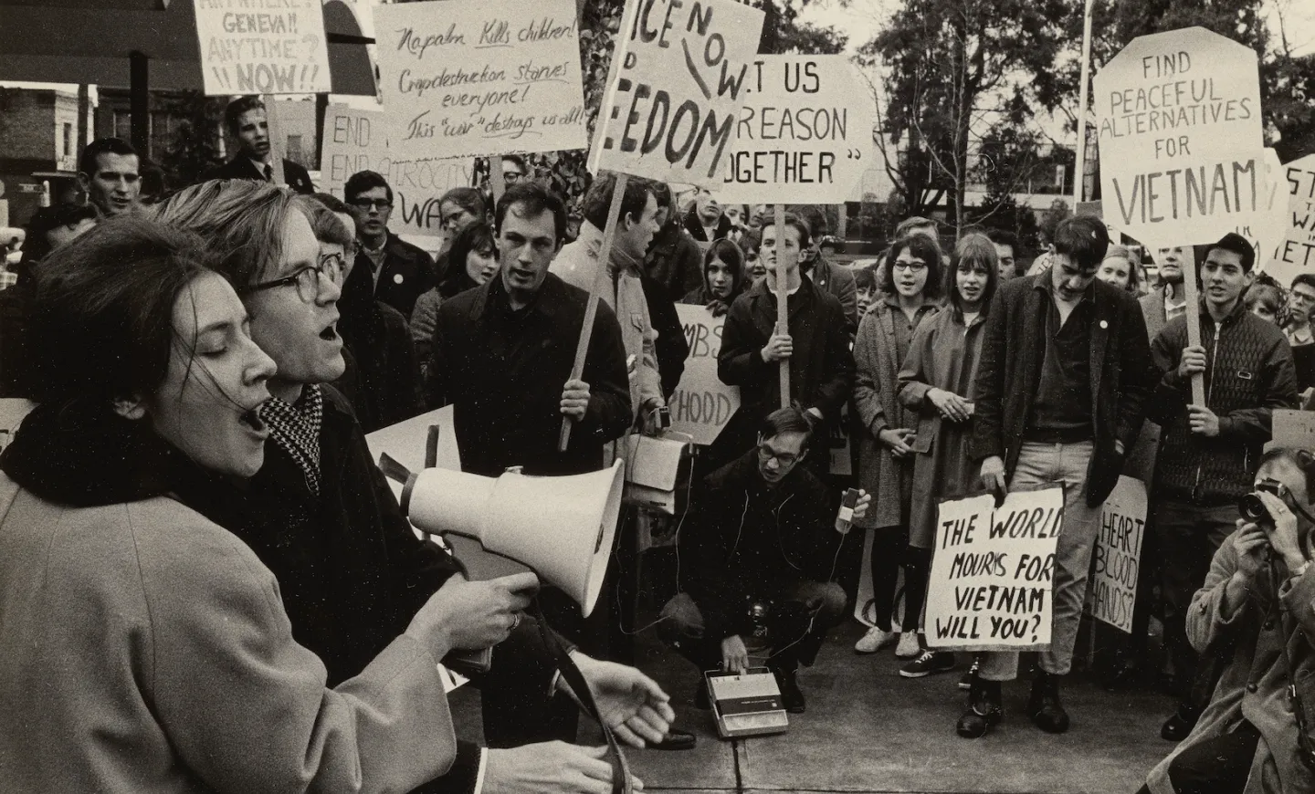 Protestors holding signs at an Anti-Vietnam War protest held in Eugene, Oregon and on the University of Oregon campus in 1966.