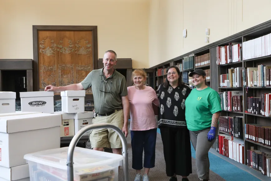 Group of people with boxes of MAD magazines in Special Collections