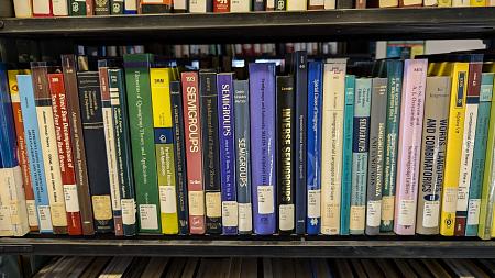 Math books on library shelf