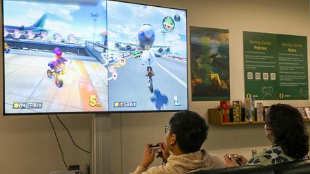 Students playing Mario Kart in the Gaming Center