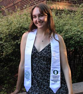 Grace Curley wearing a graduation sash.