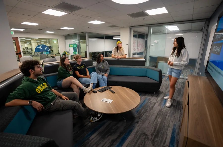 A group of students sitting on a couch in the DREAM Lab