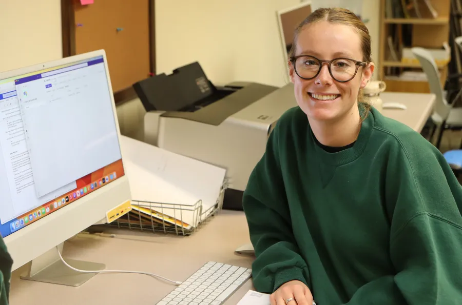 a student employee at a computer